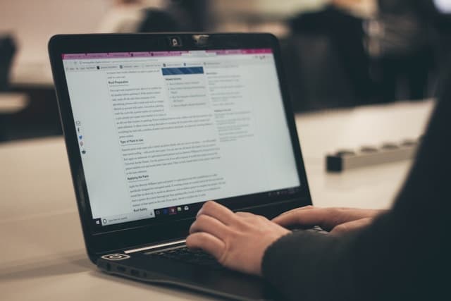 Person typing on a laptop